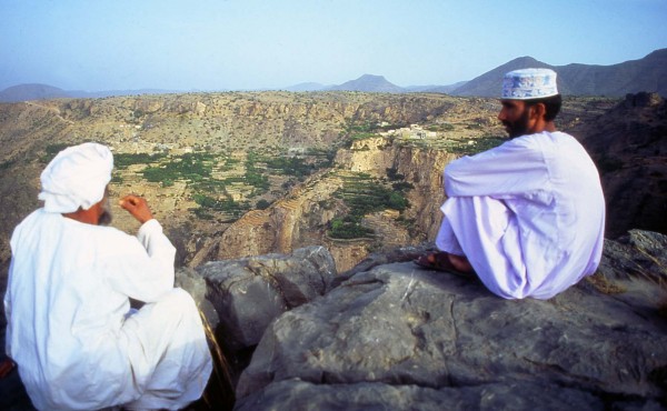 Deep in discussion in the tranquil setting of Jabal Akhdar with its terraced cultivations